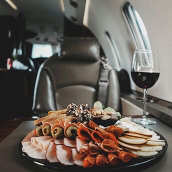 In-flight meal with charcuterie and red wine