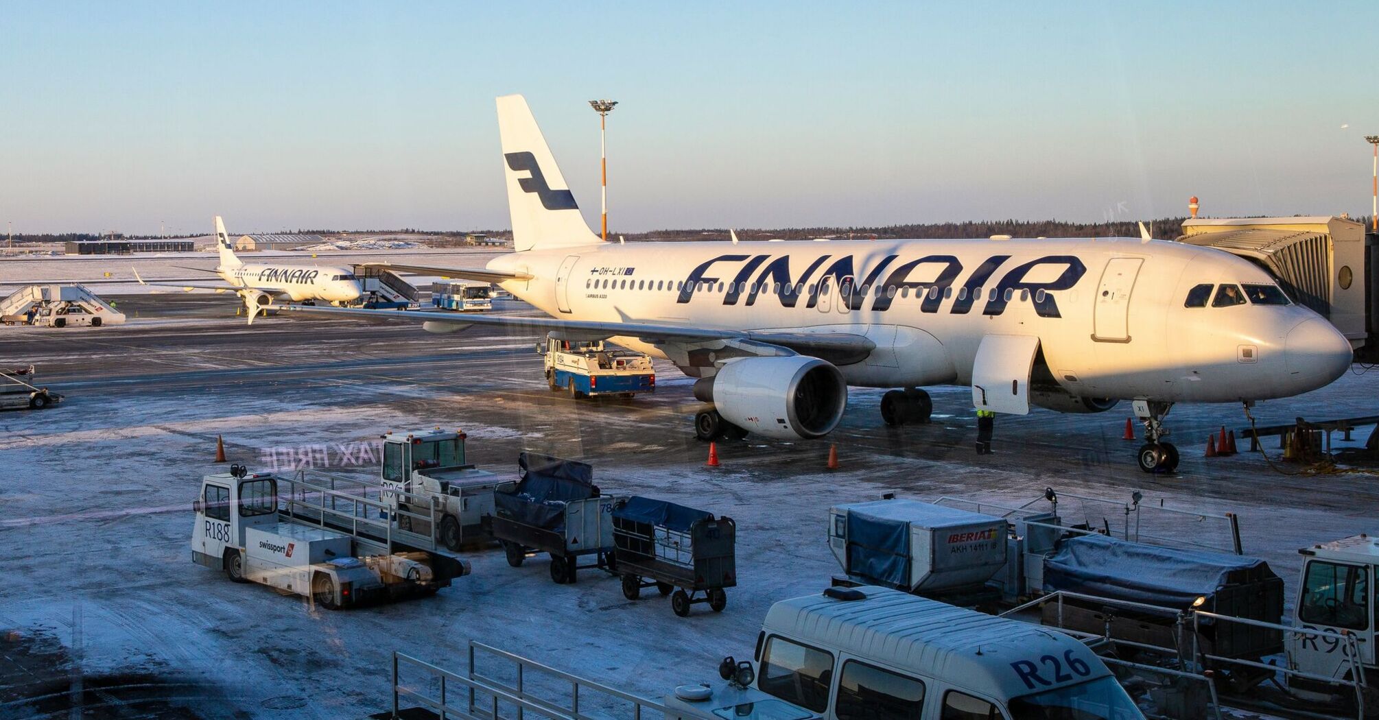 Finnair aircraft parked at snowy Helsinki Airport apron