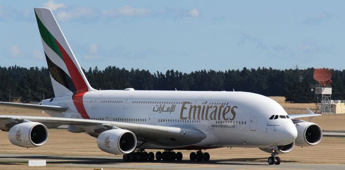 Emirates aircraft taxiing before departure.