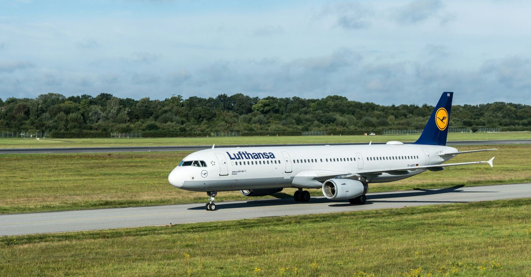 Lufthansa Airbus aircraft taxiing at an airport.