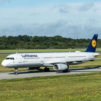 Lufthansa Airbus aircraft taxiing at an airport.