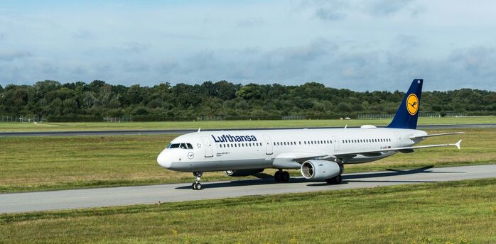 Lufthansa Airbus aircraft taxiing at an airport.