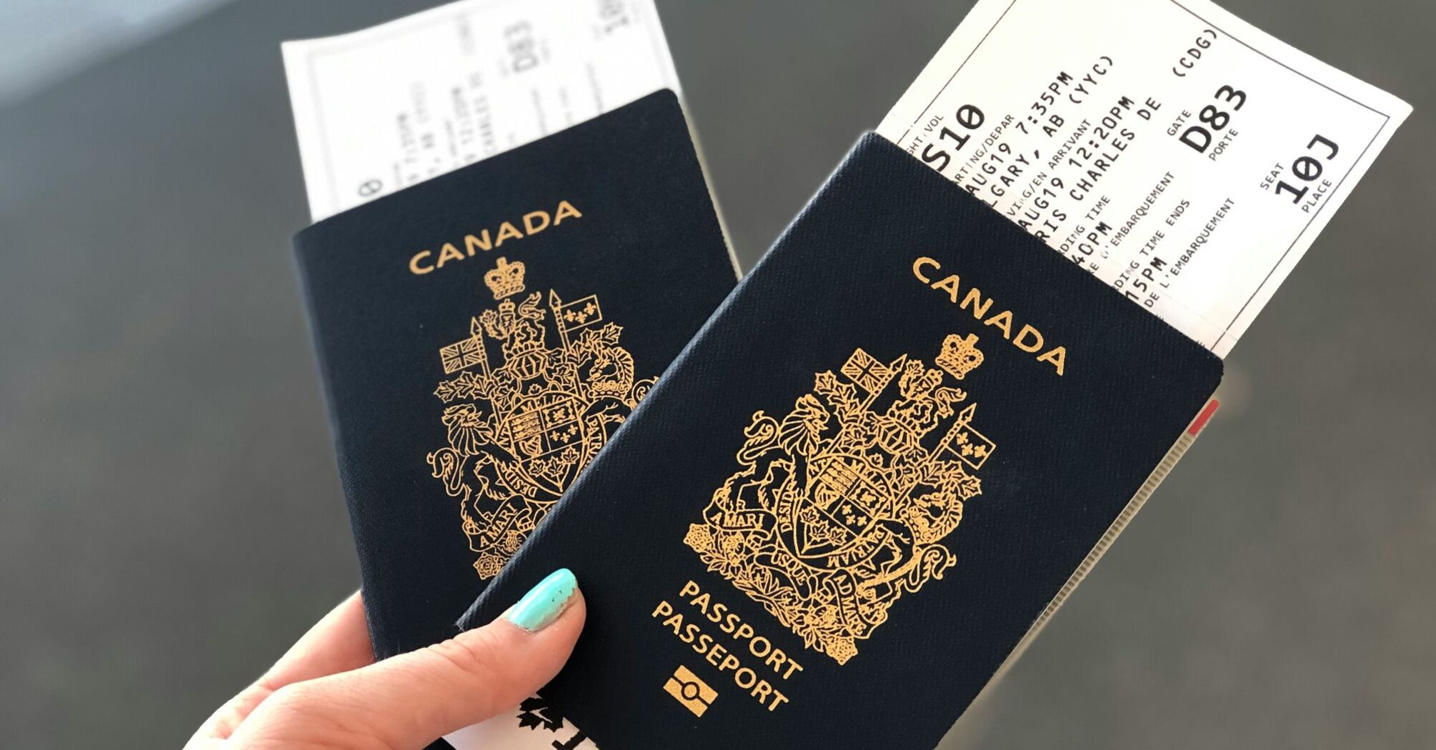 Two Canadian passports held with boarding passes