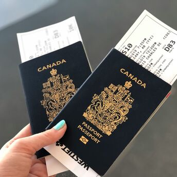 Two Canadian passports held with boarding passes