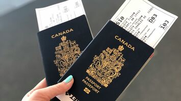 Two Canadian passports held with boarding passes