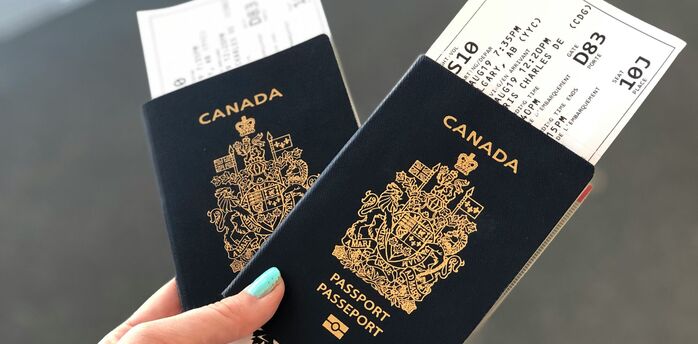 Two Canadian passports held with boarding passes
