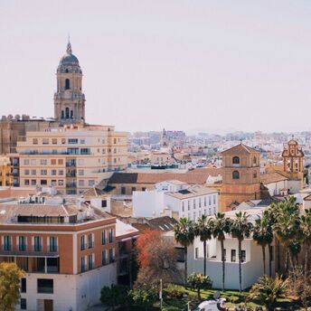 Daytime cityscape of Malaga with cathedral and residential buildings