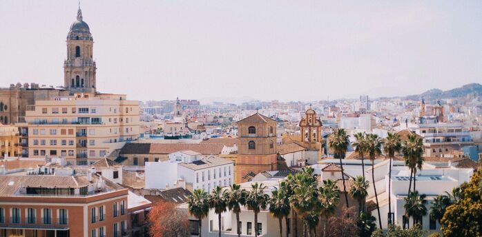 Daytime cityscape of Malaga with cathedral and residential buildings