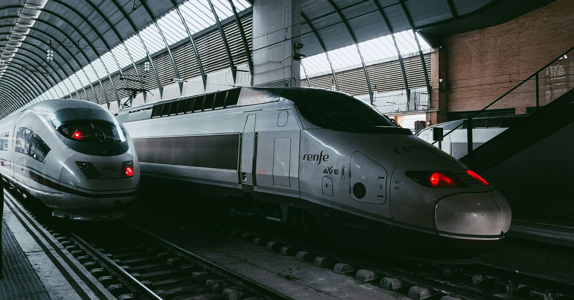 Renfe high-speed trains at a station platform