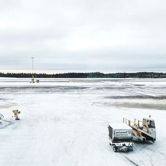 Snow-covered airport apron during winter weather