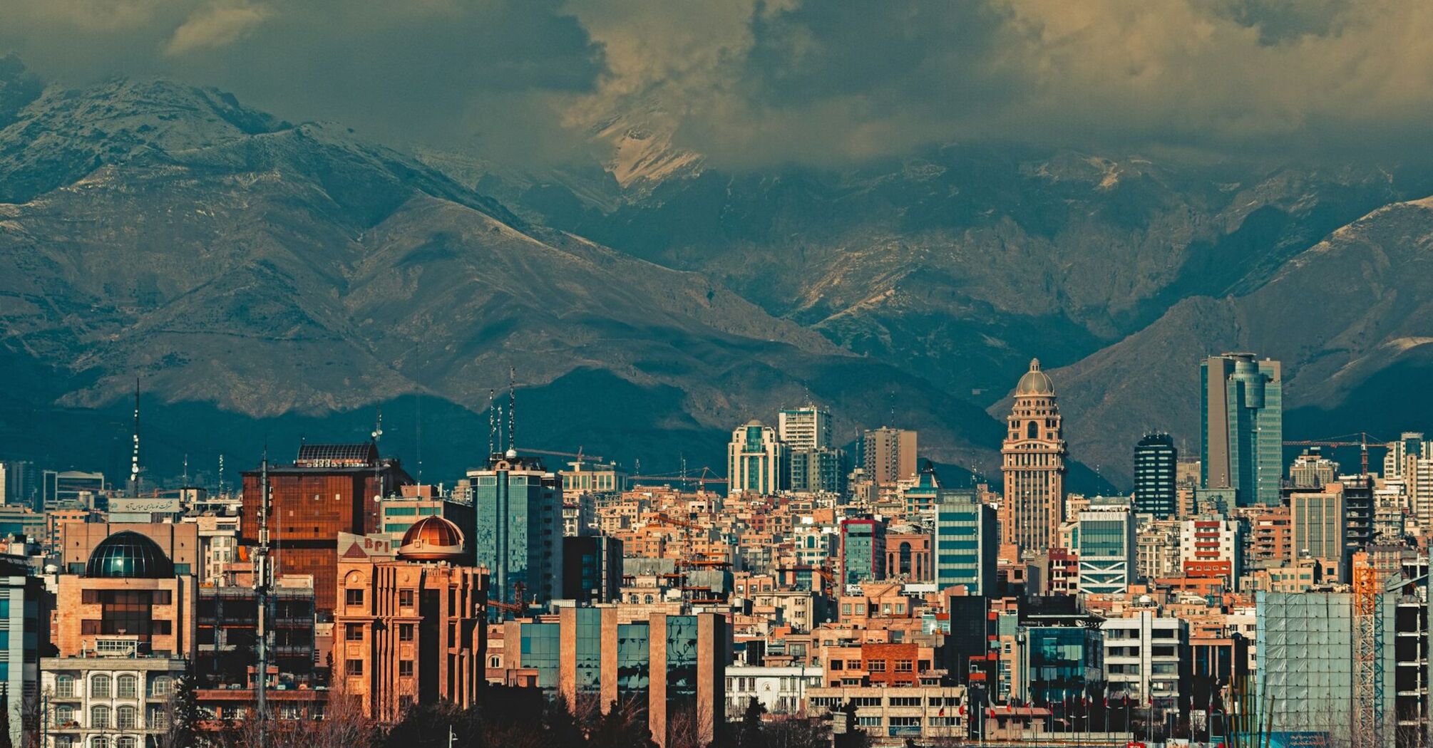 Tehran skyline backed by snow-capped mountains