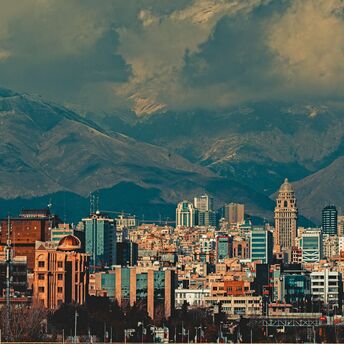 Tehran skyline backed by snow-capped mountains
