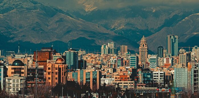 Tehran skyline backed by snow-capped mountains