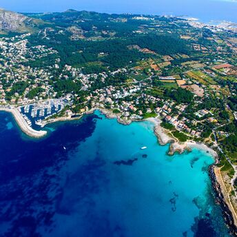 Aerial view of Mallorca’s coastline with turquoise bays and towns