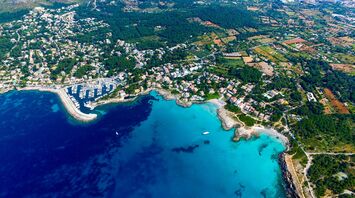 Aerial view of Mallorca’s coastline with turquoise bays and towns