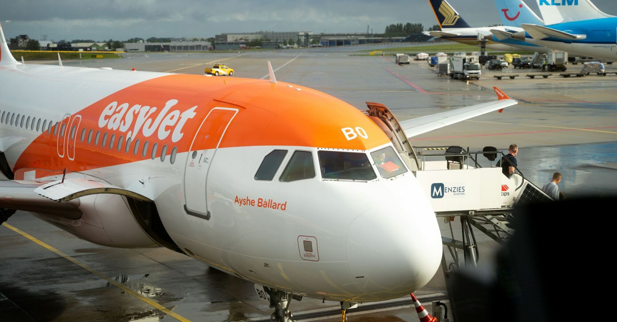 easyJet aircraft parked at a European airport gate