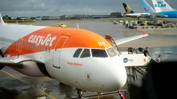 easyJet aircraft parked at a European airport gate