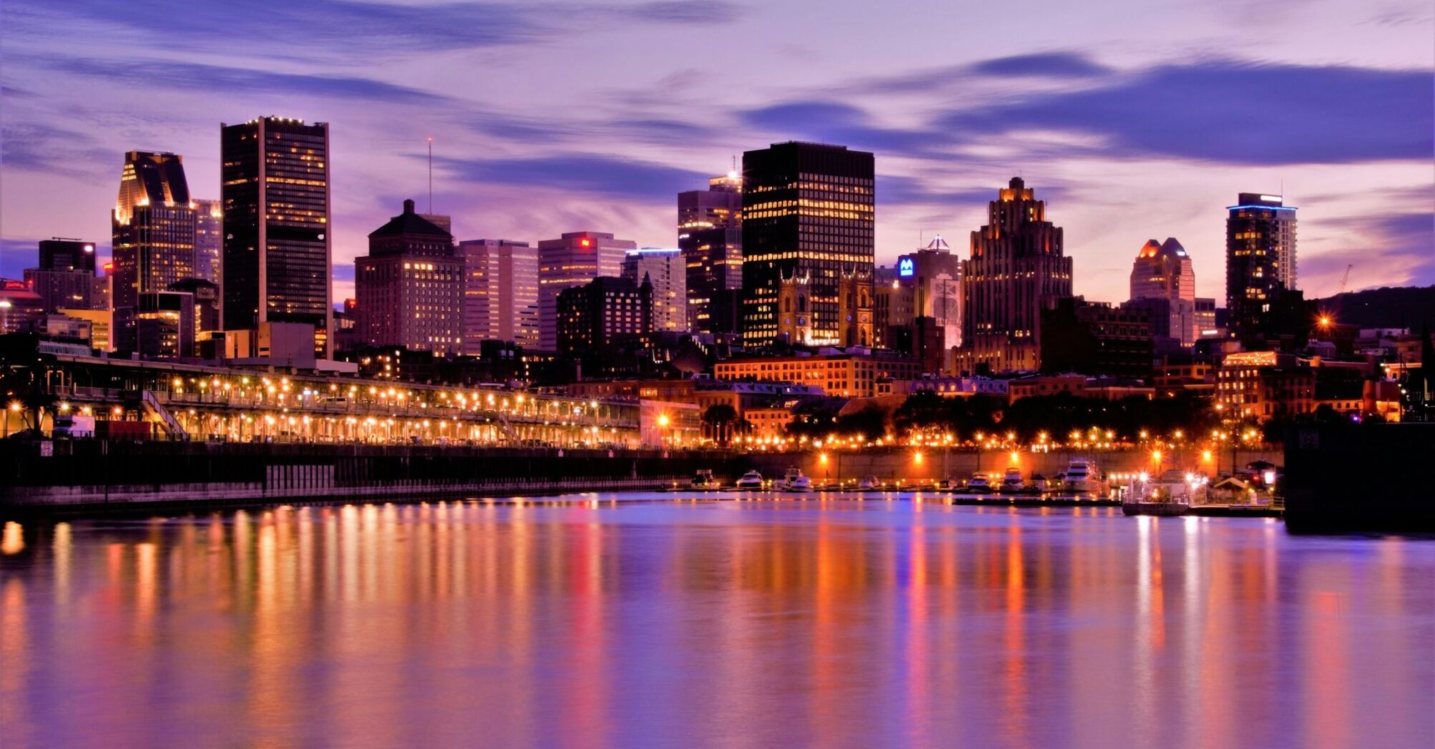 Montreal skyline at dusk along the Saint Lawrence River