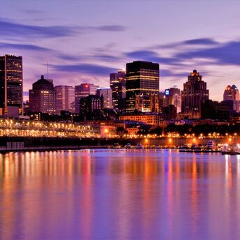 Montreal skyline at dusk along the Saint Lawrence River