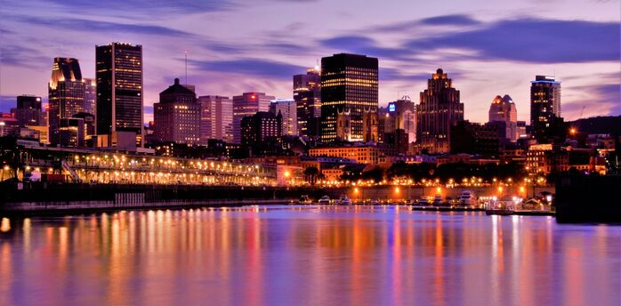 Montreal skyline at dusk along the Saint Lawrence River