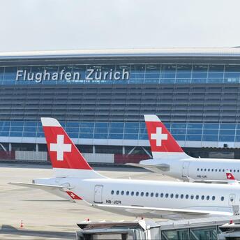 SWISS aircraft parked at Zurich Airport terminal