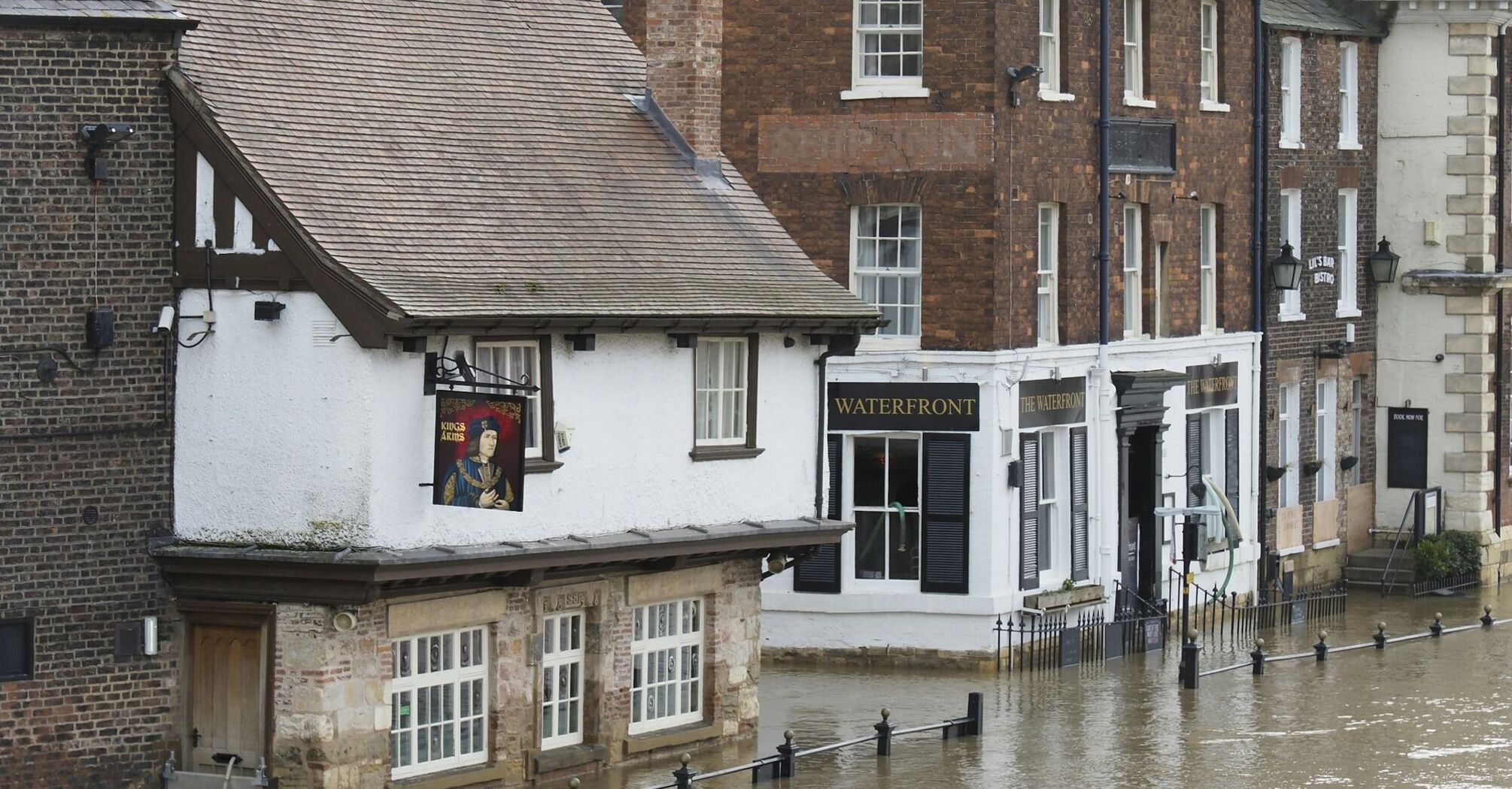 Flooded street in Devon town after heavy rain