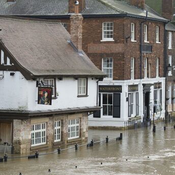 Flooded street in Devon town after heavy rain