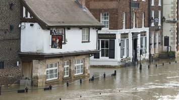 Flooded street in Devon town after heavy rain