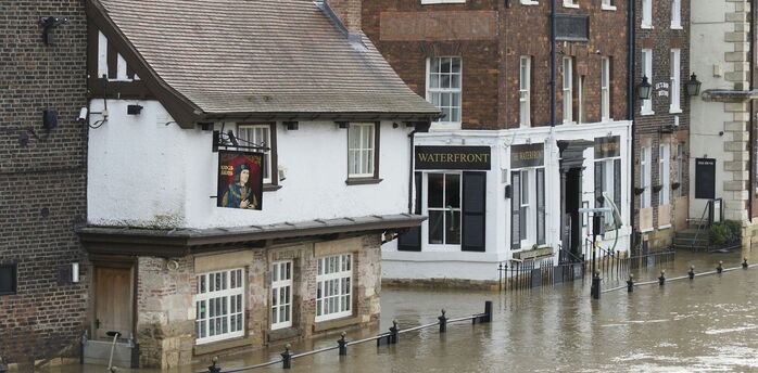 Flooded street in Devon town after heavy rain