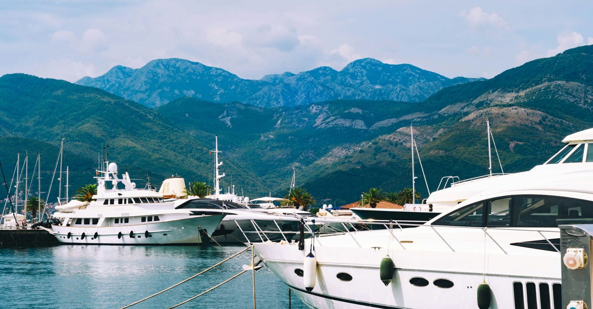 Montenegro marina with yachts and mountains