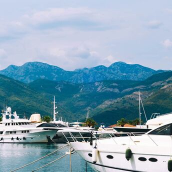 Montenegro marina with yachts and mountains