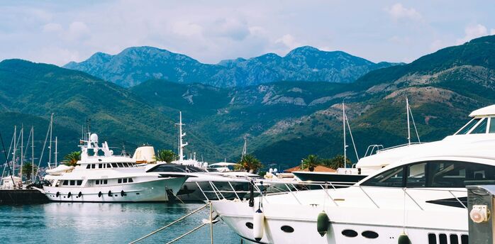 Montenegro marina with yachts and mountains