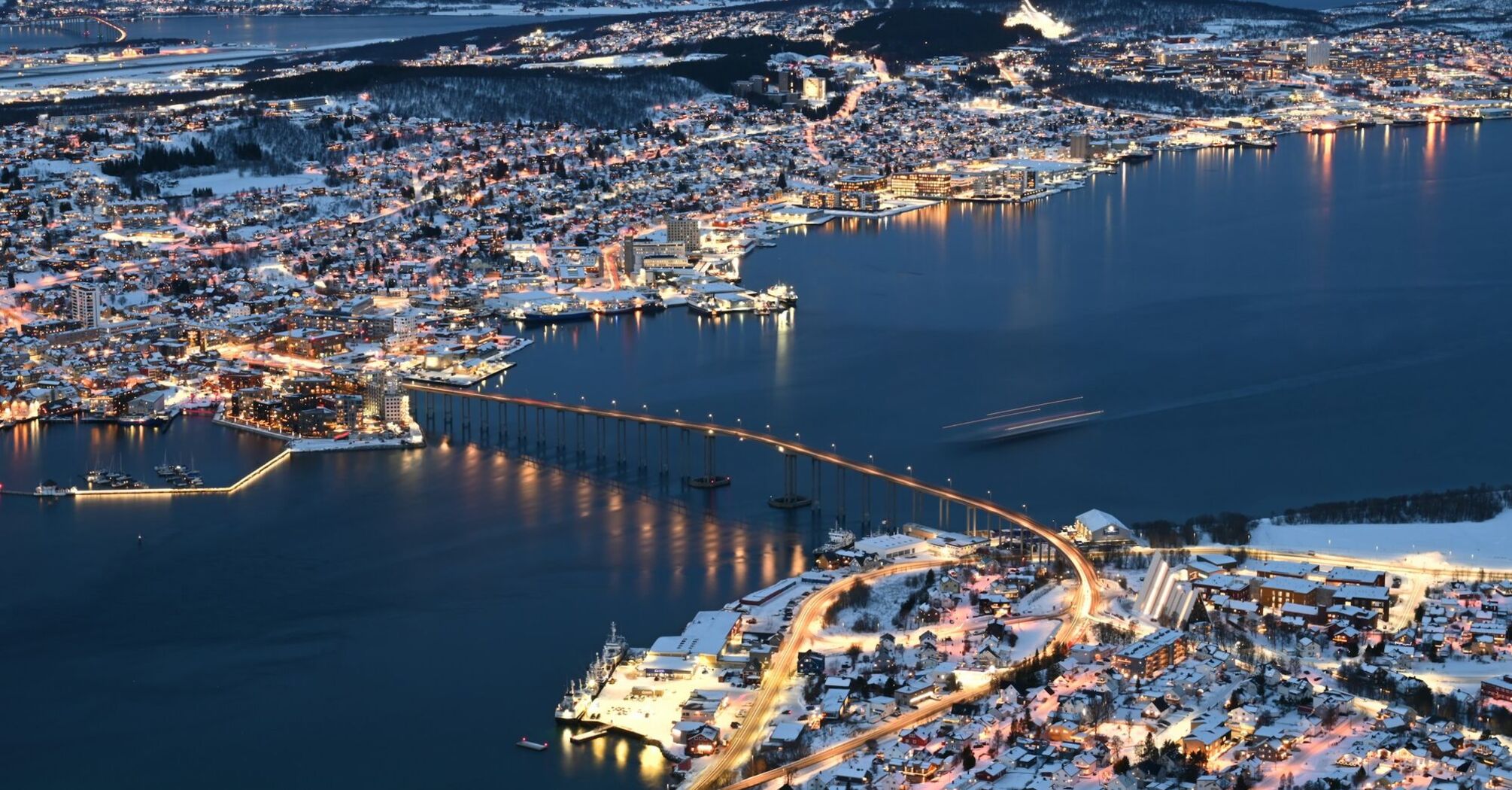 Aerial view of Tromsø city and bridge at night