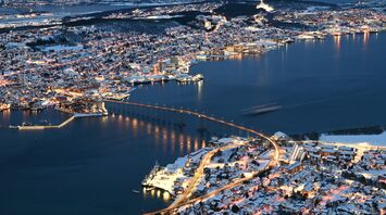 Aerial view of Tromsø city and bridge at night