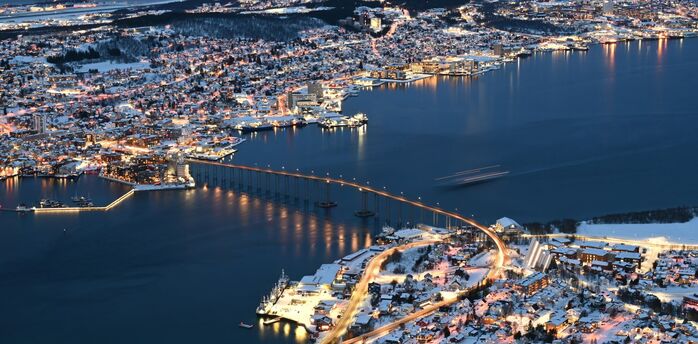 Aerial view of Tromsø city and bridge at night