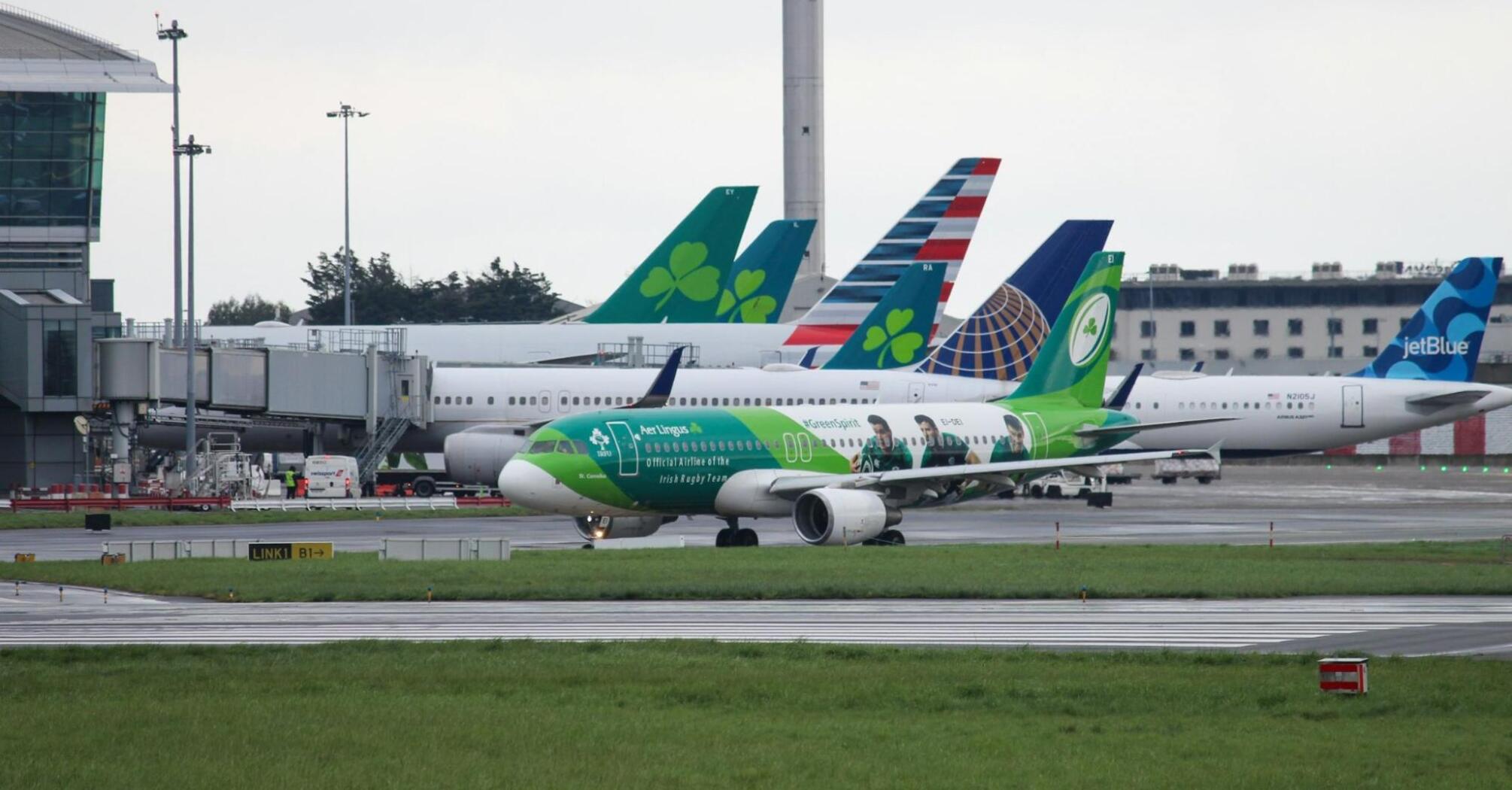 Aer Lingus aircraft taxiing at Irish airport amid winter conditions