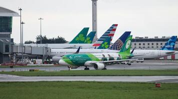 Aer Lingus aircraft taxiing at Irish airport amid winter conditions