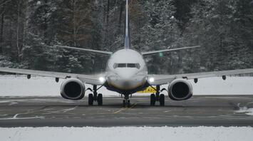 Commercial aircraft on runway during winter conditions