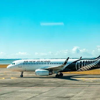 Air New Zealand aircraft on runway during daytime