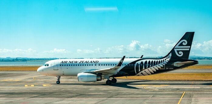 Air New Zealand aircraft on runway during daytime