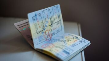 Passport pages with multiple entry and exit stamps