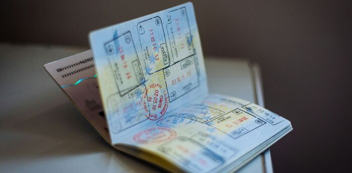 Passport pages with multiple entry and exit stamps