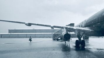 Aircraft on a snowy apron during winter weather disruption