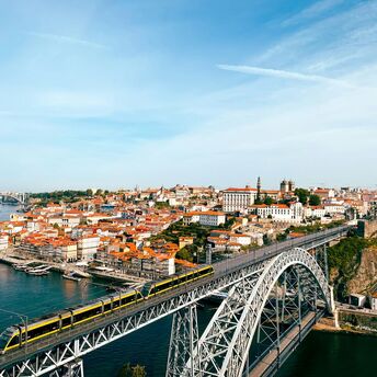 Metro train crossing Porto’s Dom Luís Bridge