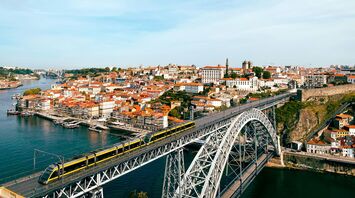 Metro train crossing Porto’s Dom Luís Bridge