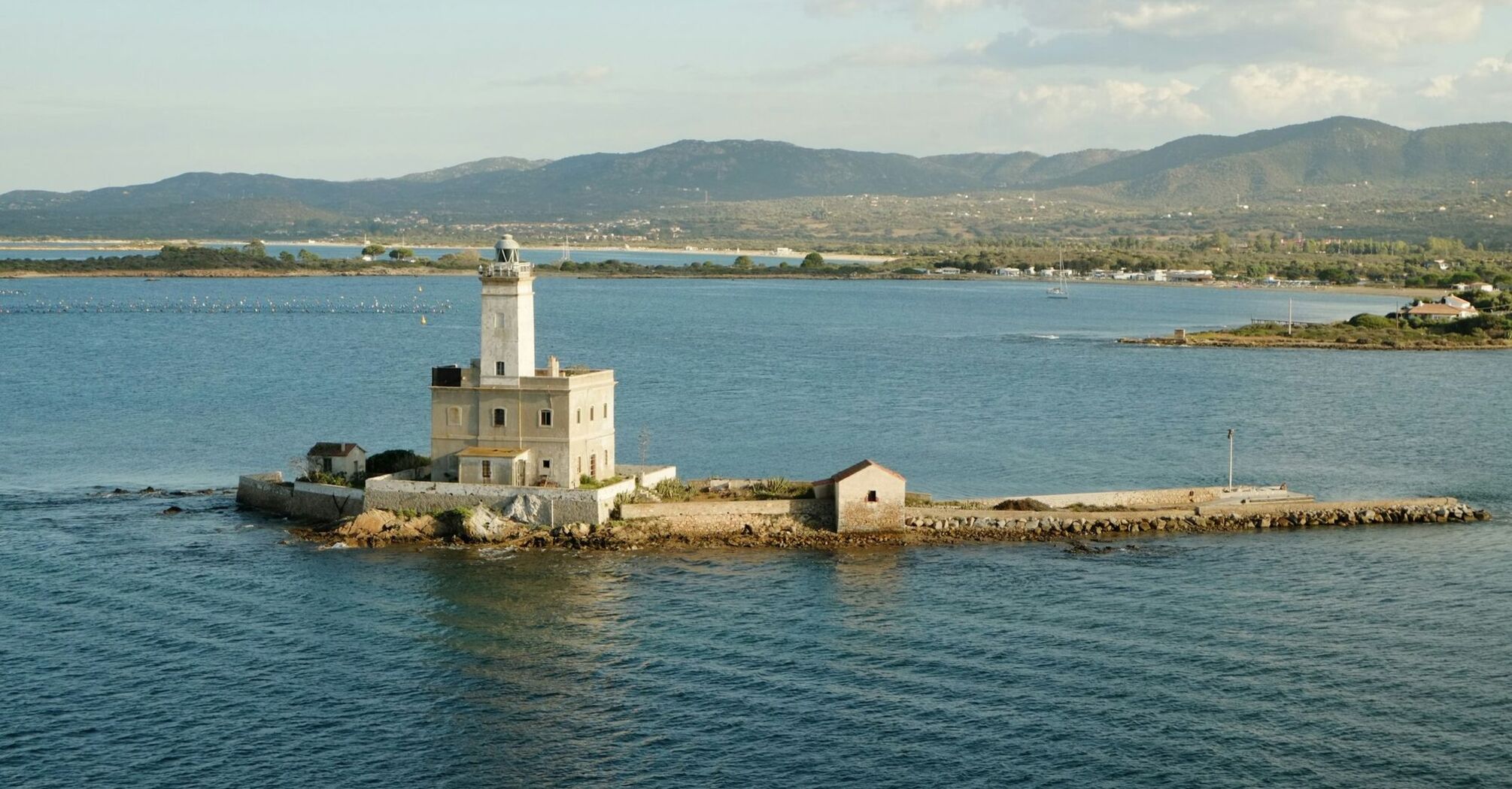 Stone lighthouse on a small island off the Sardinian coast