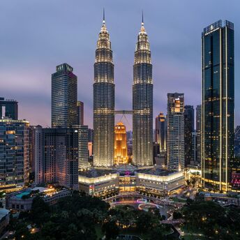 Petronas Twin Towers and Kuala Lumpur skyline at dusk
