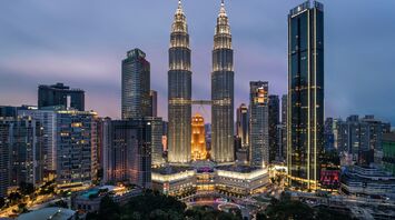 Petronas Twin Towers and Kuala Lumpur skyline at dusk