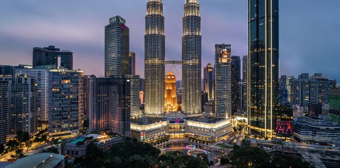 Petronas Twin Towers and Kuala Lumpur skyline at dusk