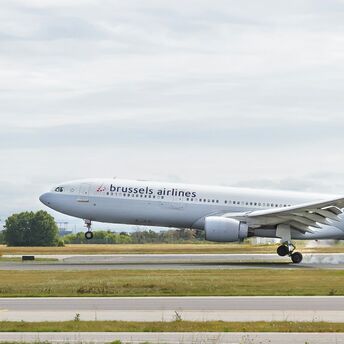 Brussels Airlines aircraft landing on a runway